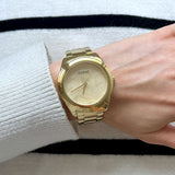 Guess Cubed Analog Gold Dial Gold Steel Strap Watch For Women - GW0606L2
